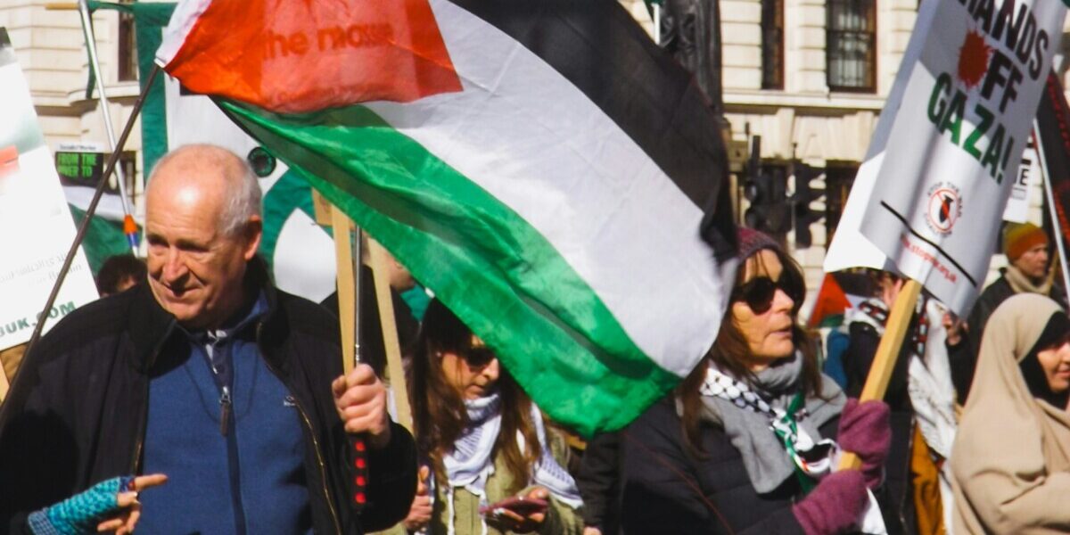 https://unsplash.com/photos/people-are-protesting-with-palestinian-flags-and-signs-eM2XG_PN2fE?utm_source=unsplash&utm_medium=referral&utm_content=creditShareLink